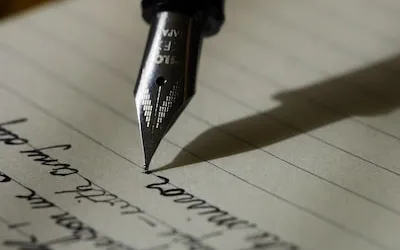A fountain pen writing a letter
